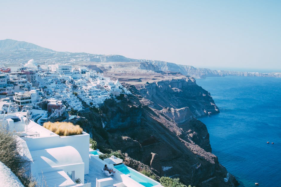 Breathtaking view of Santorini's iconic white buildings on cliffs overlooking the Aegean Sea.