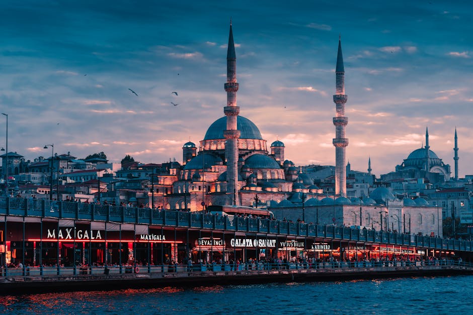 Captivating twilight view of Istanbul's New Mosque and Eminönü district reflecting vibrant city life.