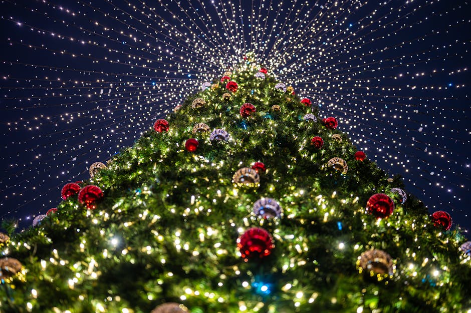 A beautifully decorated Christmas tree with glowing lights and colorful ornaments, capturing the festive spirit.