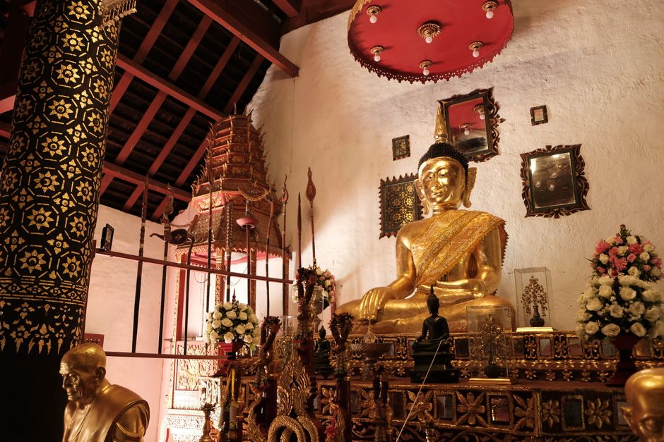 Golden Buddha inside a decorated temple in northern Thailand