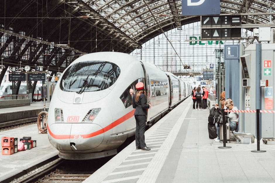 Passengers boarding a high-speed train at a modern German railway station.
