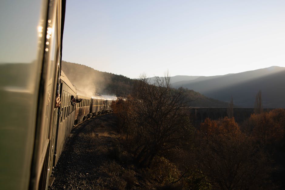 Vintage train captures autumn sunset in Canfranc, Aragón. Rich history and scenic beauty.