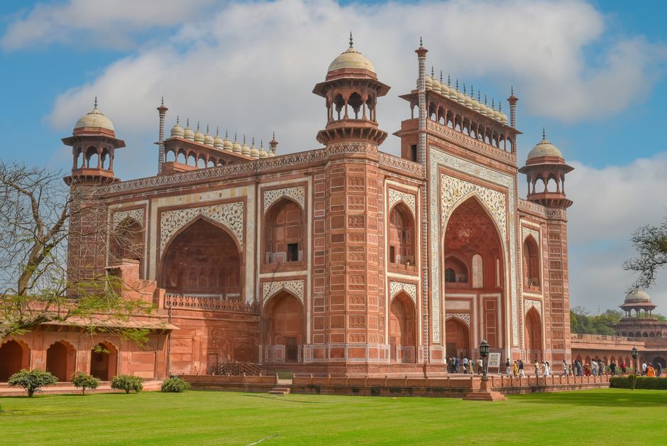 Majestic view of the ornate entrance at the Red Fort, Agra, India on a sunny day.